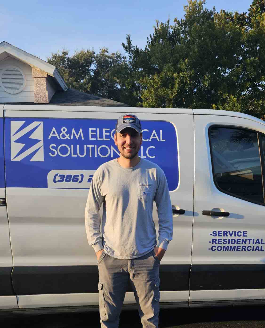 Ariel Hernandez Electrician with his van
